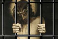 Jesus wearing crown of thorns holding prison bars inside a cell.